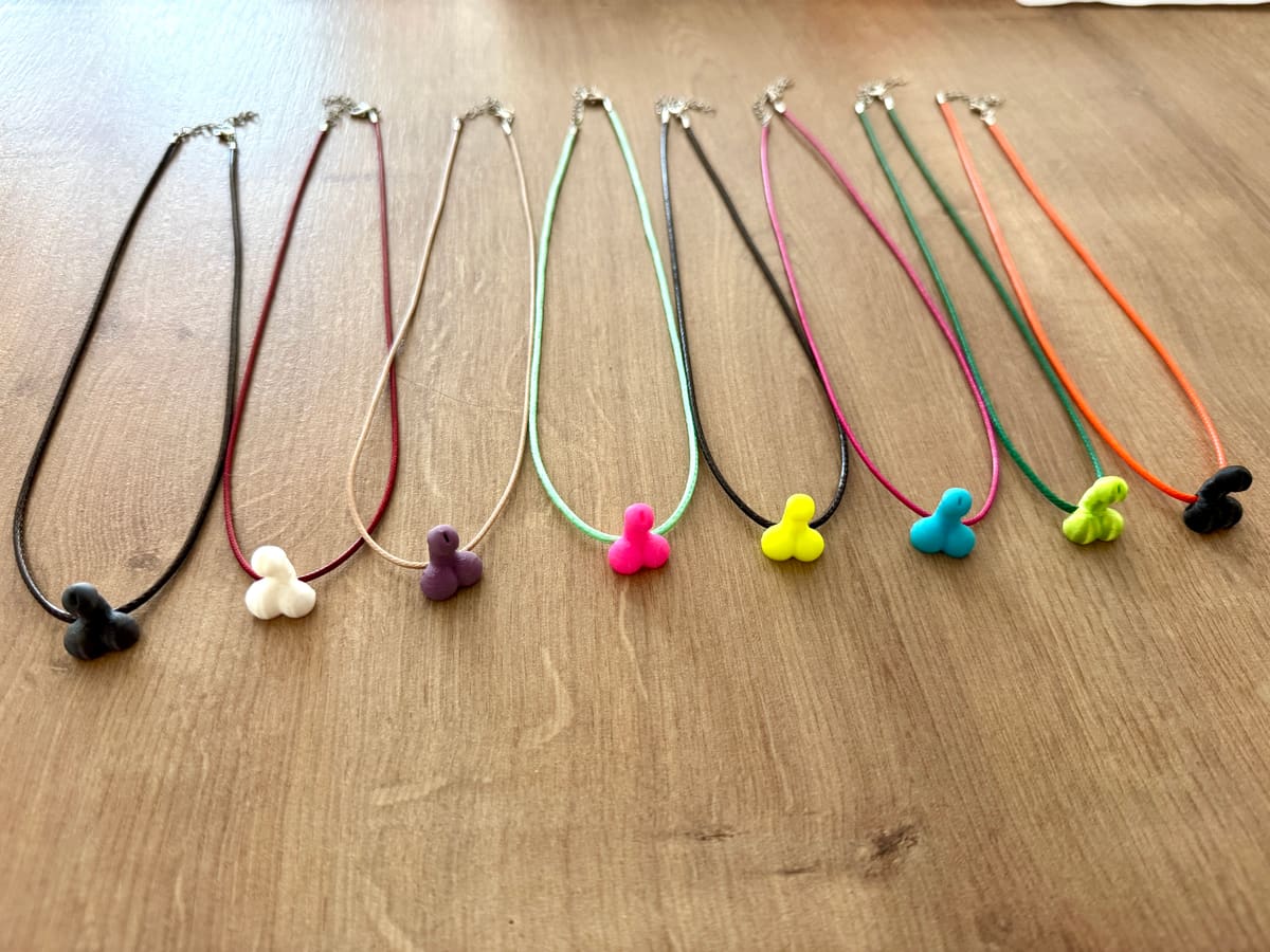 Novelty charm necklaces on colored cords in many colors